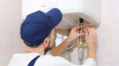 Man check Water Heater Maintenance